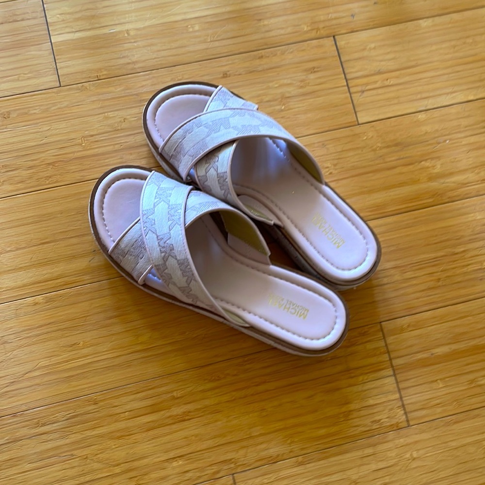 Brand new worn once by me light pink slip on sandals in size 6.5 Michael Kors